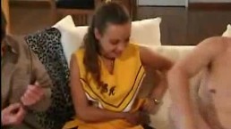 cheerleader sucks on two cock