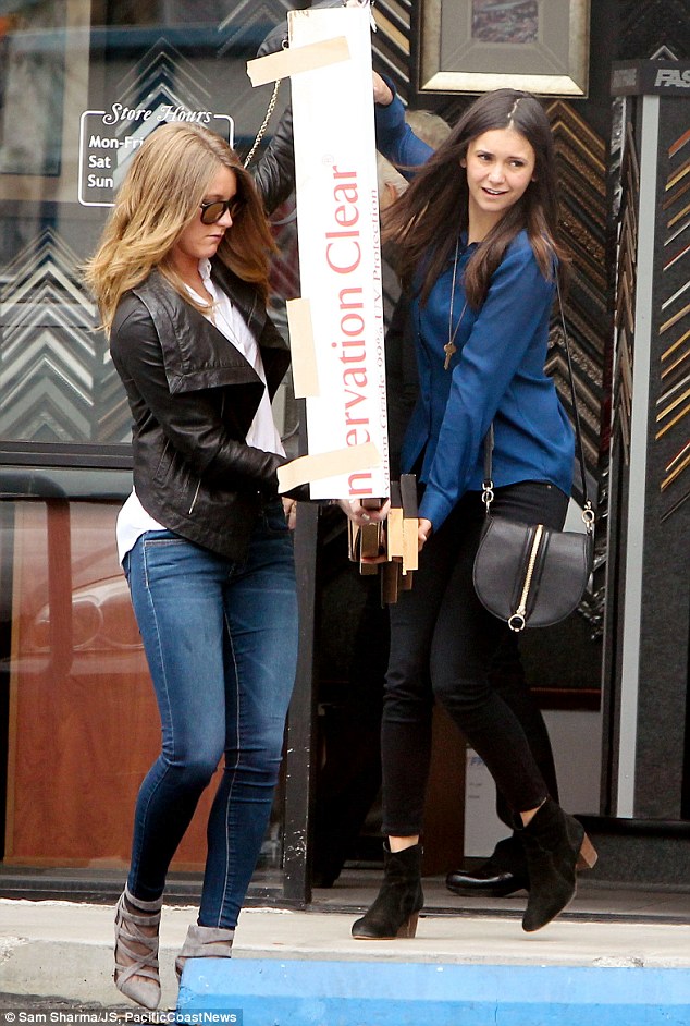 superhuman strength vampire diaries star nina dobrev showed her power as she helped a friend
